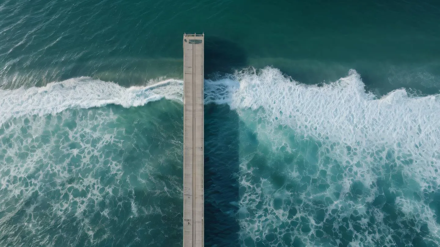 Serene ocean waves meeting geometric concrete pier drone view from above zinc and white tones with subtle green sea highlights morning golden hour lighting high-quality ultra-realistic cinematic 8K UHD high resolution sharp and detail