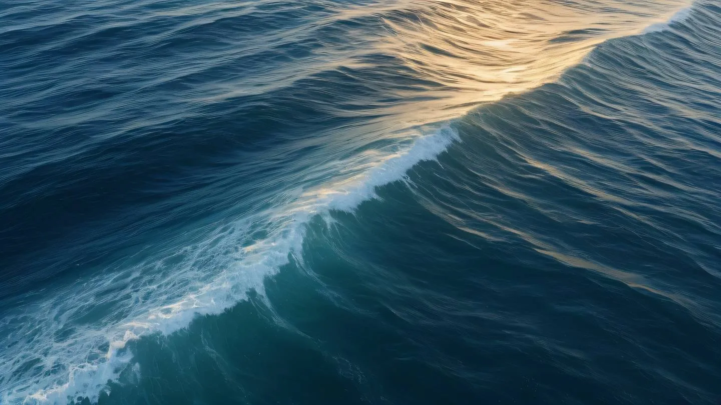 A serene ocean wave pattern with smooth curves in ochre and sapphire blue colors photographed from a bird's eye view high-quality ultra-realistic cinematic 8K UHD high resolution sharp and detail