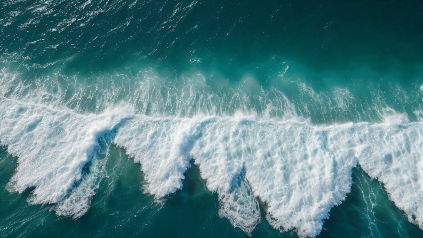 Ocean waves creating geometric patterns viewed from above dark green water mixing with bright white foam aerial perspective natural light rays penetrating water surface high-quality ultra-realistic cinematic 8K UHD high resolution sharp and detailed