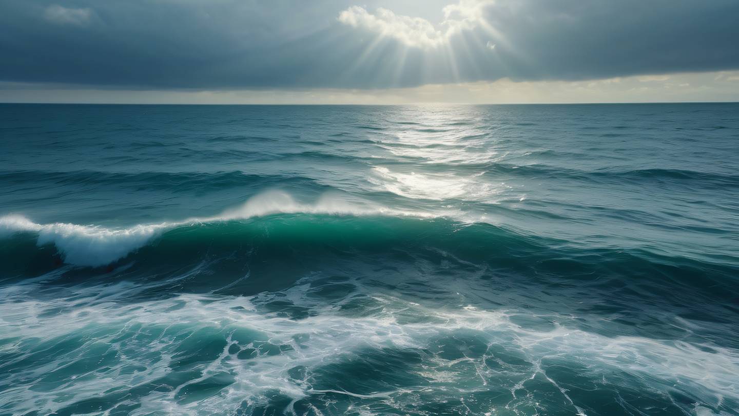 Smooth ocean waves with sunlight breaking through clouds creating dramatic light rays in seaweed green and stone blue colors photographed from a bird's eye view high-quality ultra-realistic cinematic 8K UHD high resolution sharp and detail